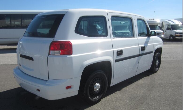 A boxy white SUV.