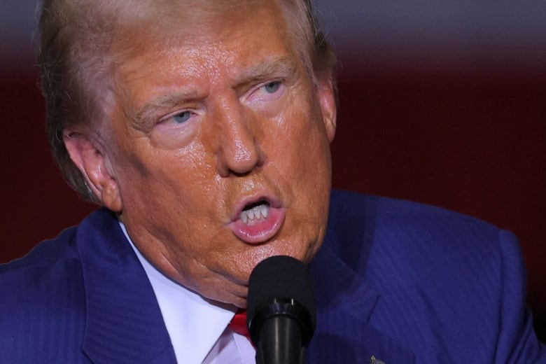 Former U.S. president Donald Trump is seen speaking at a manufacturing plant in Potterville, Mich., on Thursday.