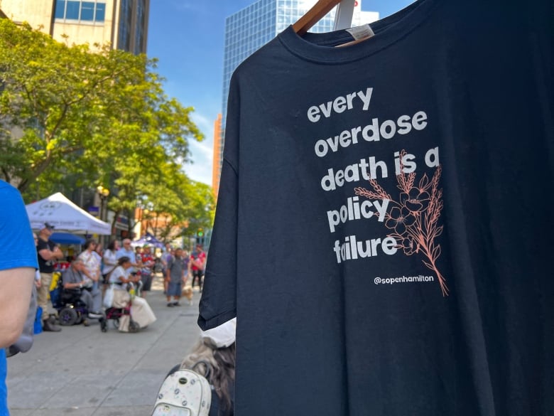 A handing t-shirt that reads 