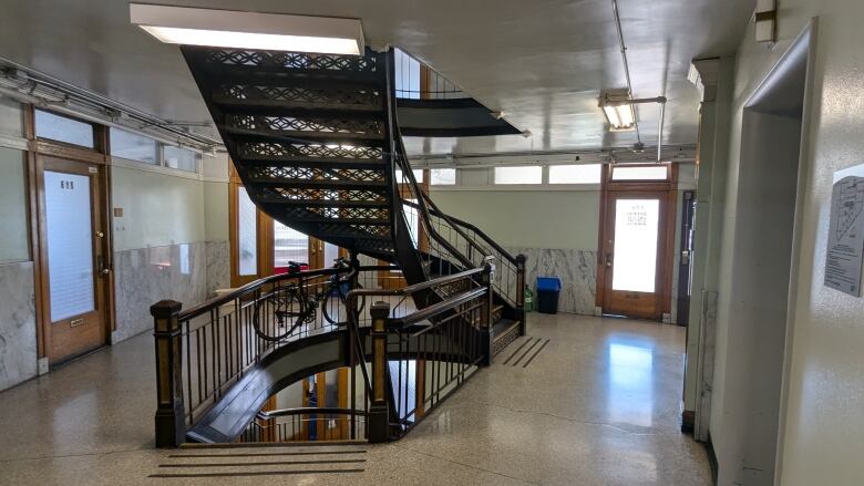 Wider shot of a winding staircase.