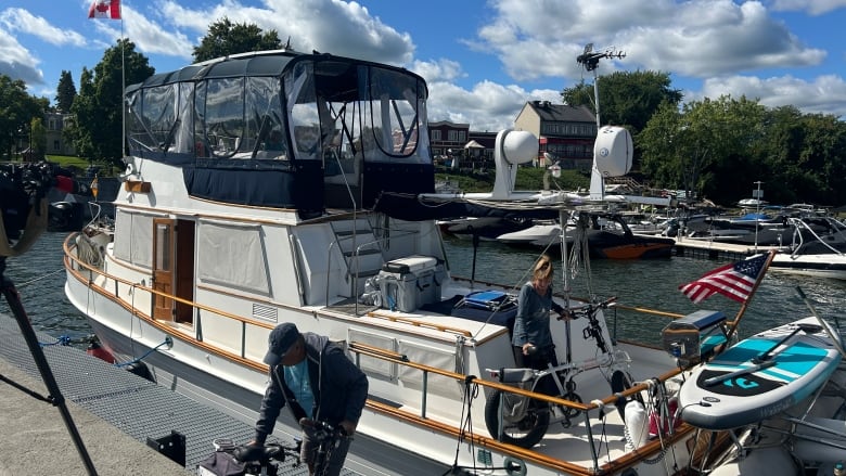 people on a boat in a marina