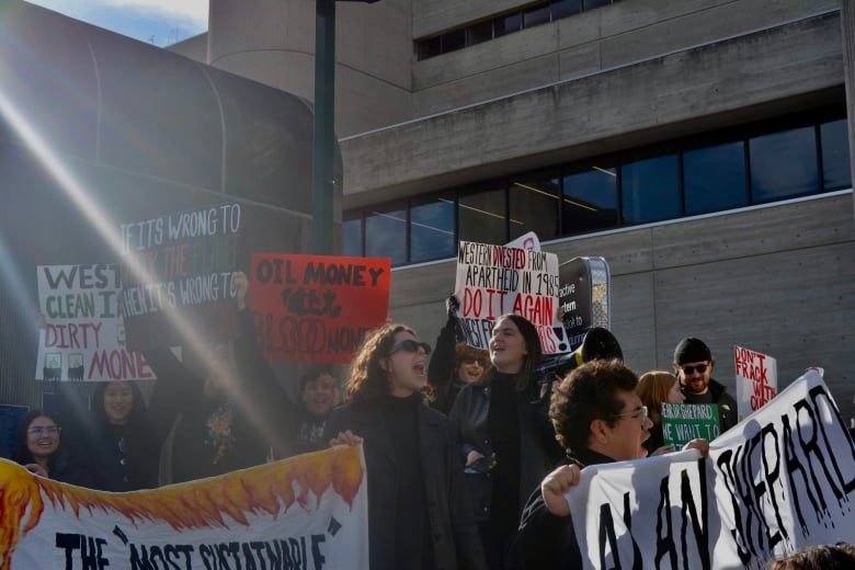 Eva Deligiannis, centre, is a member of the student-led climate crisis coalition at Western. She says the university's new policy around on-campus protests is restricting students' voices. 