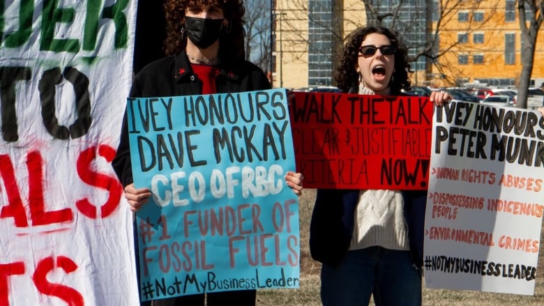 Eva Deligiannis, in the centre holding a red sign, is a member of the student-led climate crisis coalition at Western. She says the university's new policy around on-campus protests is restricting students' voices. 