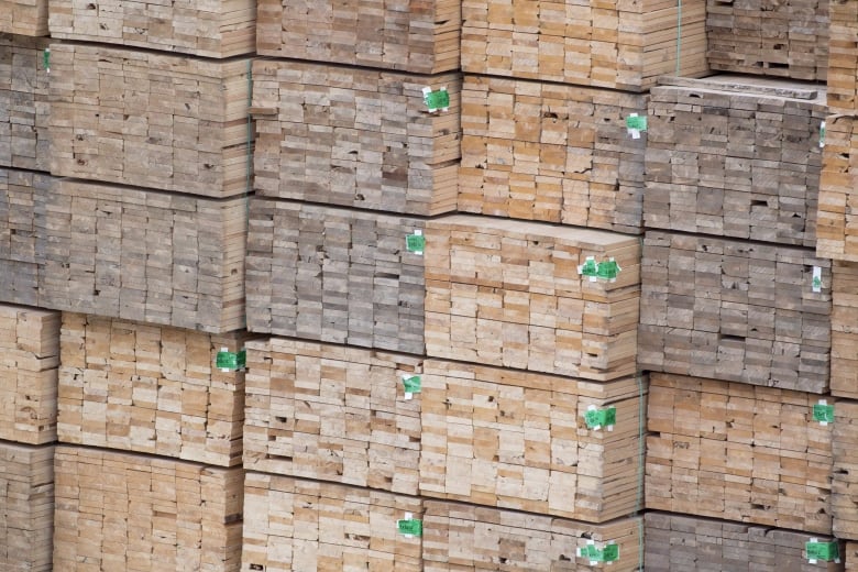 Stacks of wood pallets are seen.