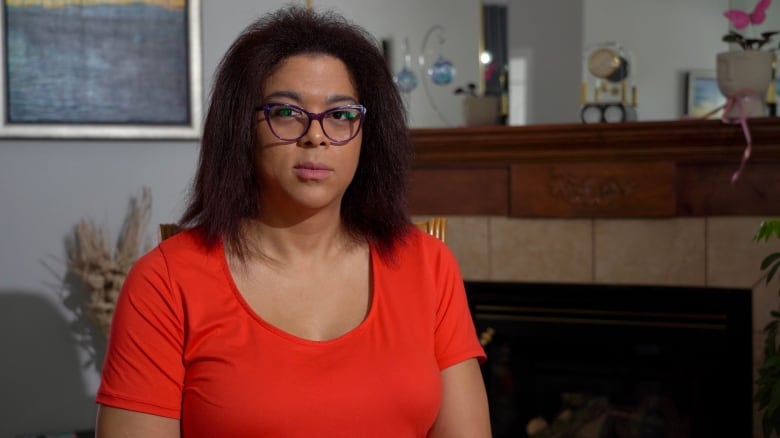 A woman in an orange t-shirt.