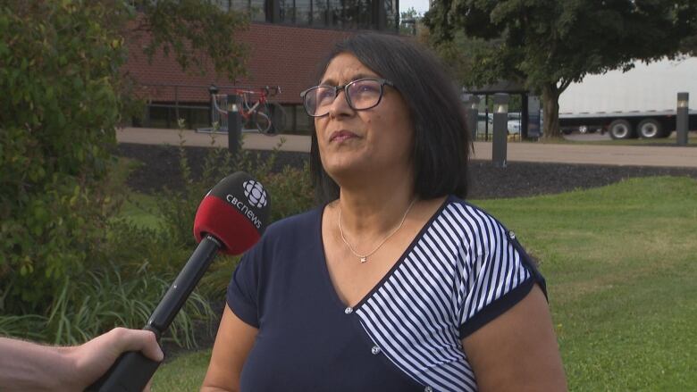 Christine Noronha stands in front of the Charlottetown Research and Development Centre