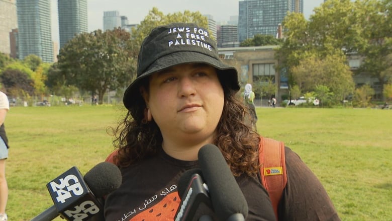 Woman wearing a hat that reads: Jews for a free Palestine. 