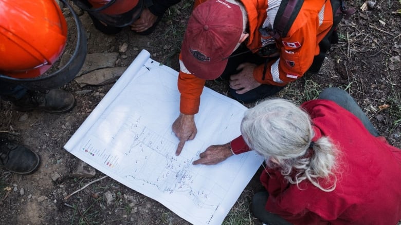 Argenta Safety and Preparedness Society members study water resources map.