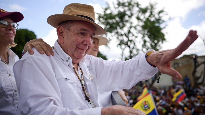 Venezuelan opposition presidential candidate Edmundo Gonzalez greets supporters during a campaign rally.