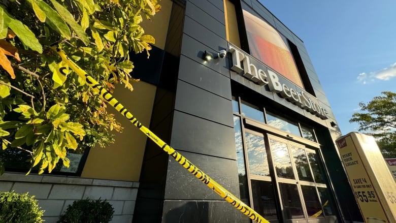 Beer store entrance, police tape hanging