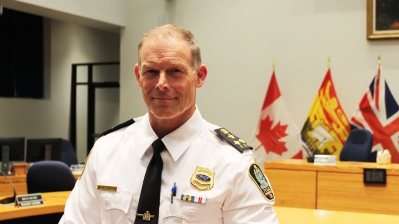 Gary Forward stands inside Fredericton council chambers.