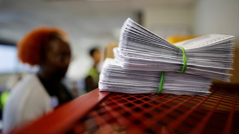 Stack of ballots on table