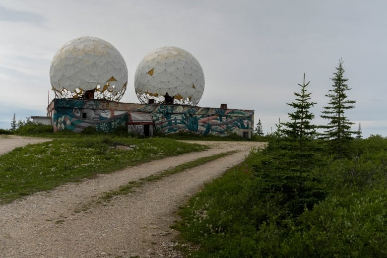 Two large domes stand atop an abandoned radar station