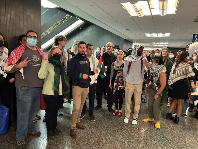 A group of people inside the courthouse. 