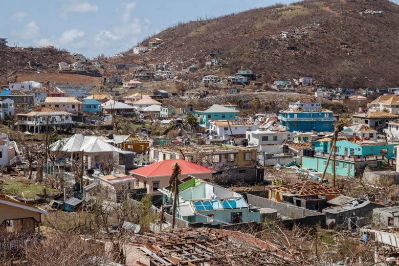 Homes destroyed by Hurricane Beryl lie in Clifton, Union Island, St. Vincent and the Grenadines in July.