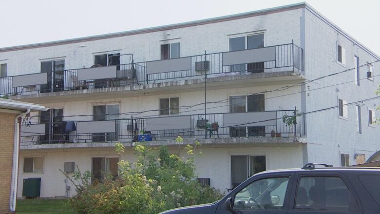 An apartment building with fire damage.