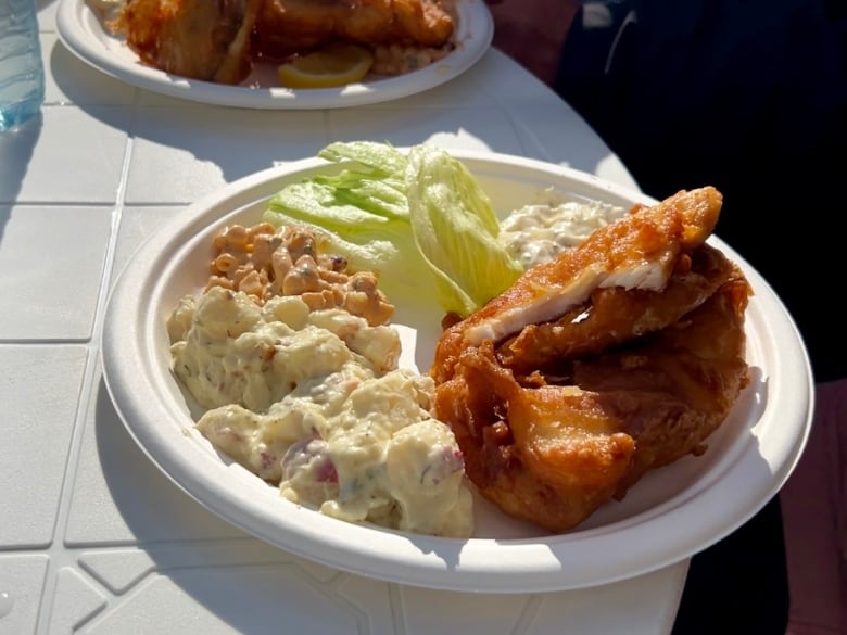 A plate of food on an outdoor table.