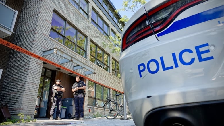 officers standing outside a building 