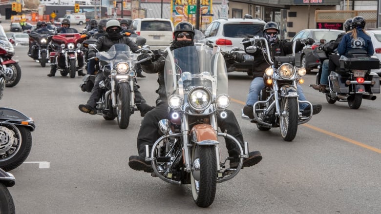 Bikers cruise through Port Dover, Ont., Friday, Nov. 13, 2020. 