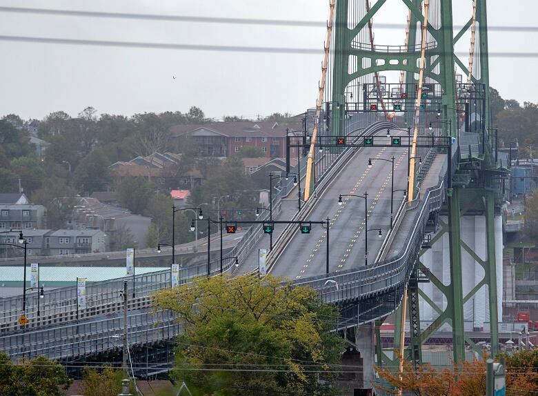 A three-lane bridge with no cars on it.