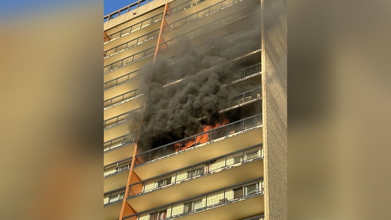 Flames engulfed a balcony on the 11th floor of an apartment.