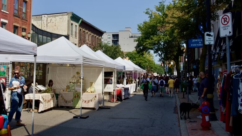 A line of booths in a street festival.