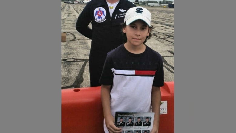 A boy at an air show.