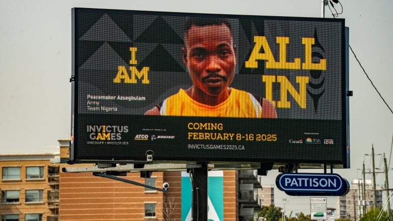 A roadside billboard advertises the 2025 Invictus Games in Whistler B.C. 