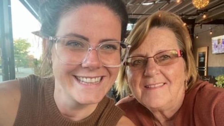 Two women posing for a selfie.