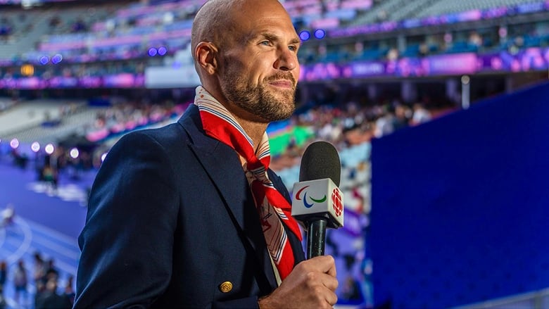 Senior reporter Devin Heroux speaks into the camera during CBC Sports' coverage of the Paralympics in Paris in September 2024.