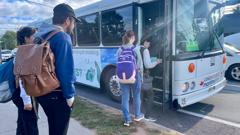 Students at UPEI board a bus headed for Summerside. 