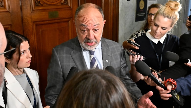 Quebec Health Minister Christian Dube responds to reporters questions over negotiations with Quebec doctors, Tuesday, May 28, 2024 at the legislature in Quebec City. 