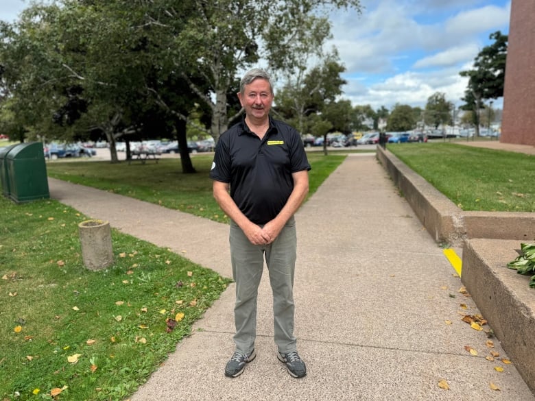 A man stands near government buildings 