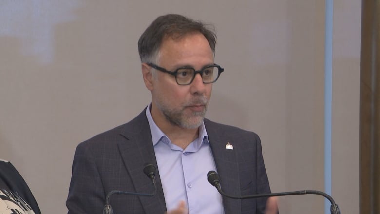 A closeup of Plateau-Mont-Royal borough mayor Luc Rabouin's face as he speaks to reporters.