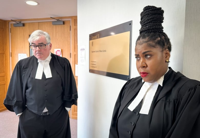 A black woman in black robes stands next to a sign while on the left a white man with grey hair, black robes and black glasses looks on.