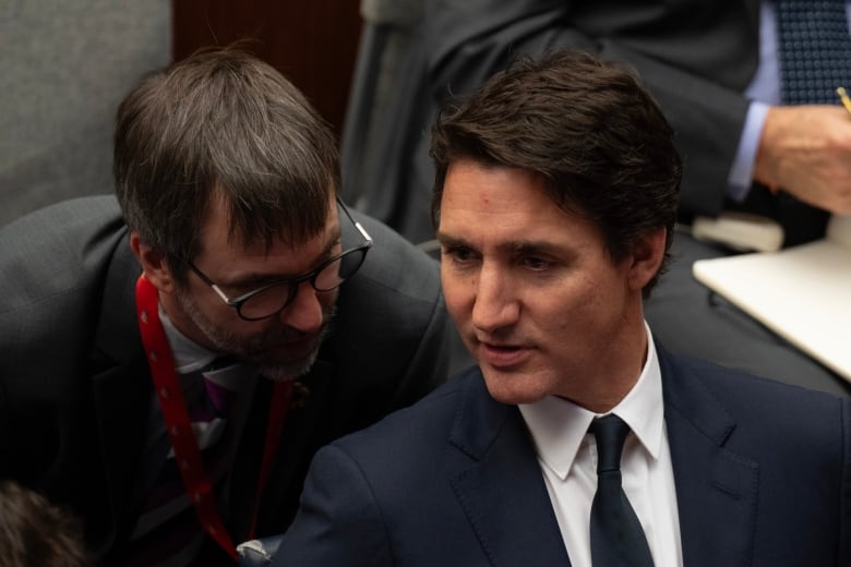 Prime Minister Justin Trudeau speaks with Minister of Environment and Climate Change Steven Guilbeault during the United Nations Secretary Generals Climate Ambition Summit at the United Nations, in New York, Wednesday, Sept. 20, 2023. THE CANADIAN PRESS/Adrian Wyld