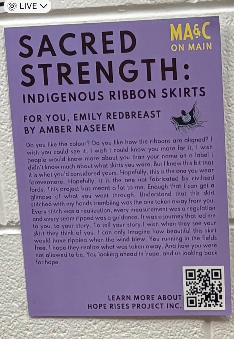 A poster of a poem written by Amber Naseem is displayed on an art gallery wall.