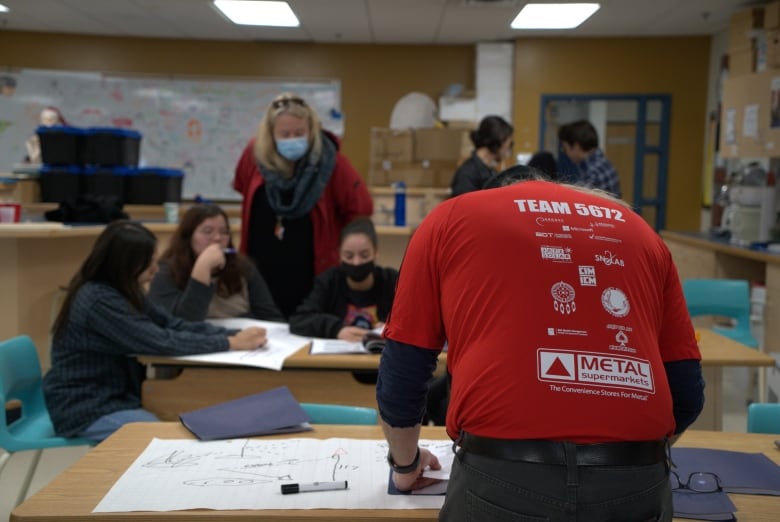 Chris Mara is pictured here doing sketches during a planning session of the Wiikwemkoong High School robotics club.