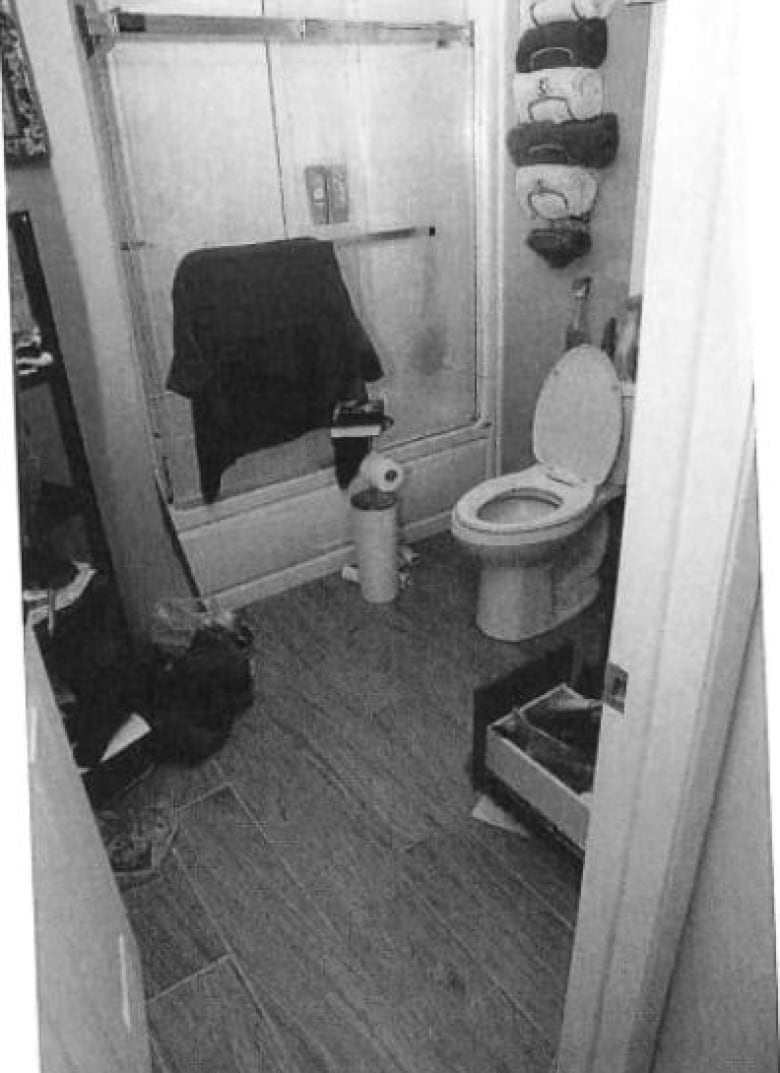 A bathroom can been seen in a photograph. 