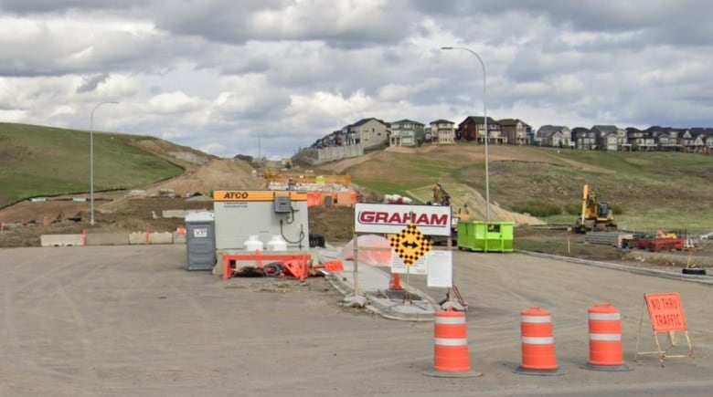 A road under construction is seen where it meets an existing road.