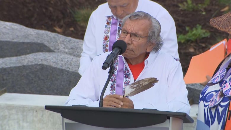 Man speaking at an outdoor event