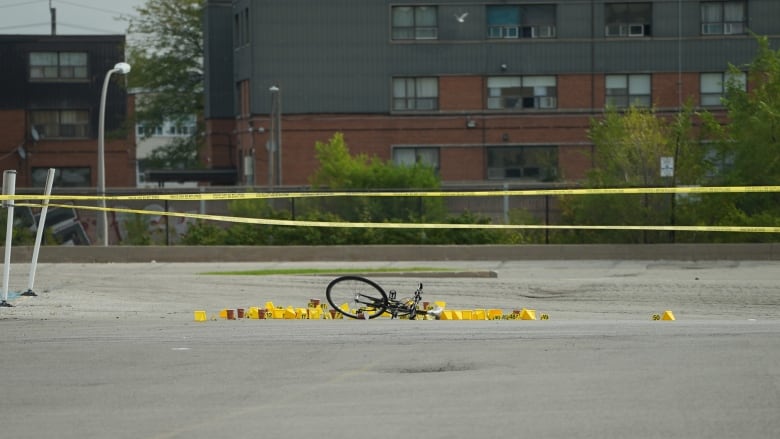 A bicycle and evidence markers at the scene of a fatal shooting in North York on Sept. 30, 2024.