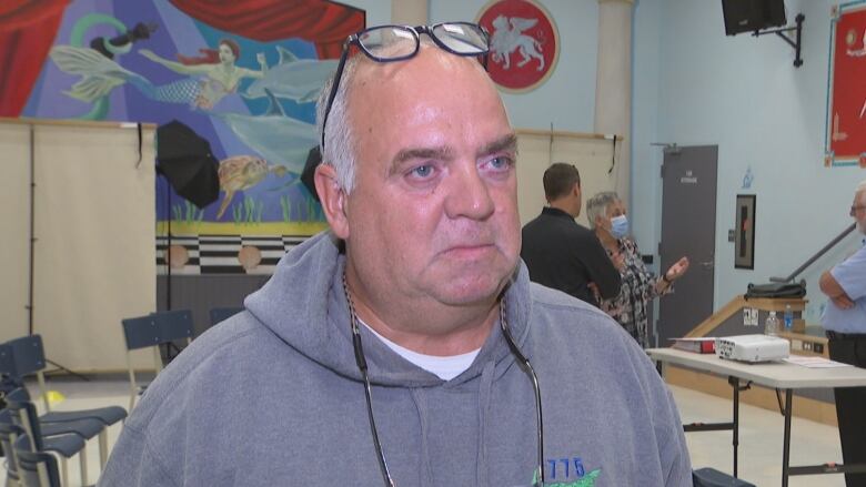 John Doucette stands in a room at Spring Park Elementary in Charlottetown.