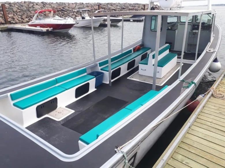 The deck of a converted lobster fishing boat as seen from the back.