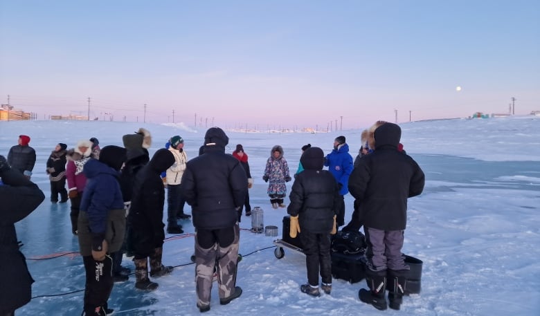 Group of Cambridge Bay locals gather near the Canadian High Arctic Research Station. 