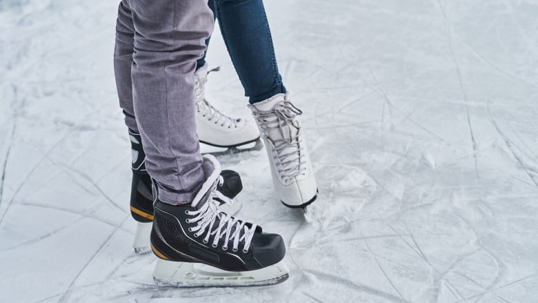 A close-up view of hockey skates and figure skates.