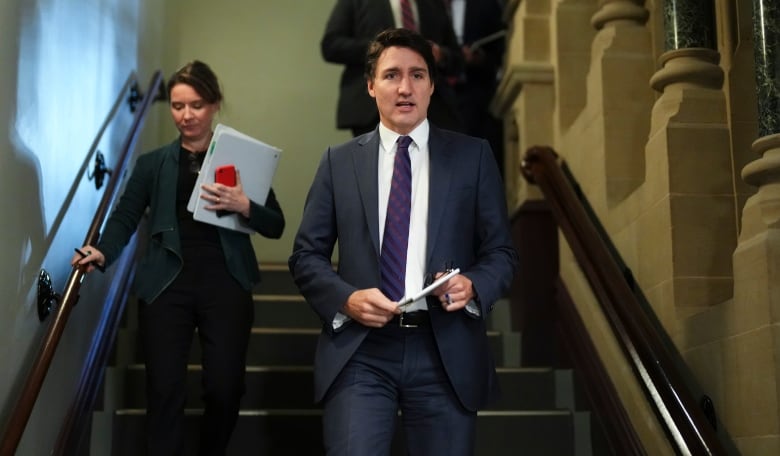 Prime Minister Justine Trudeau and his Chief of Staff Katie Telford arrive to a caucus meeting on Parliament Hill in Ottawa on Wednesday, Dec. 6, 2023.