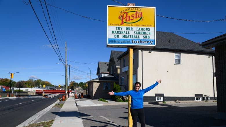 Jodie Marshall, co-owner of Marshall's Pasta Mill, stands outside of her business. She says she's glad that all lanes of Adelaide Street are now open through the underpass near Central Avenue.