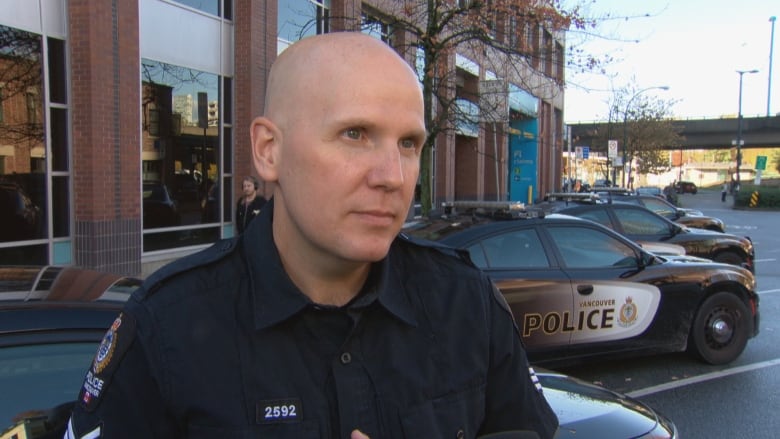 A bald police officer.