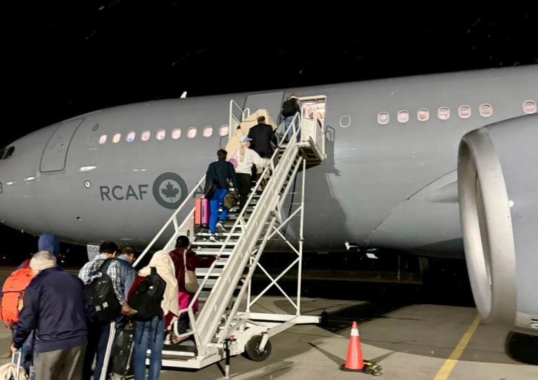 passengers board plane